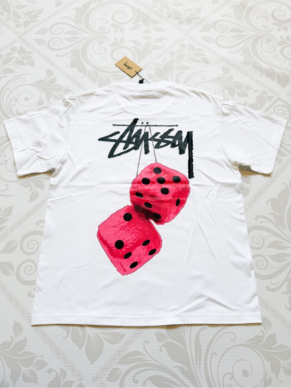 Stussy White Tee with Black Script Logo and Tan Tag